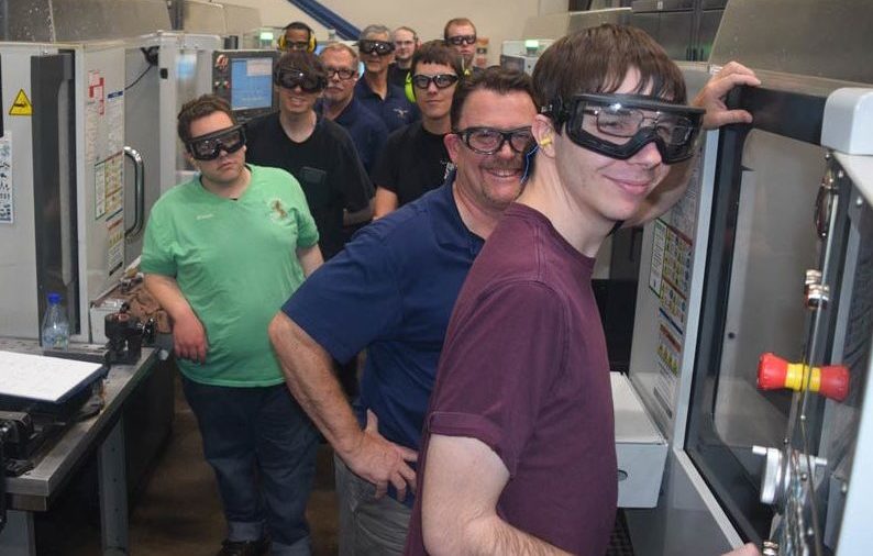 UAA apprentices infront of CNC machines